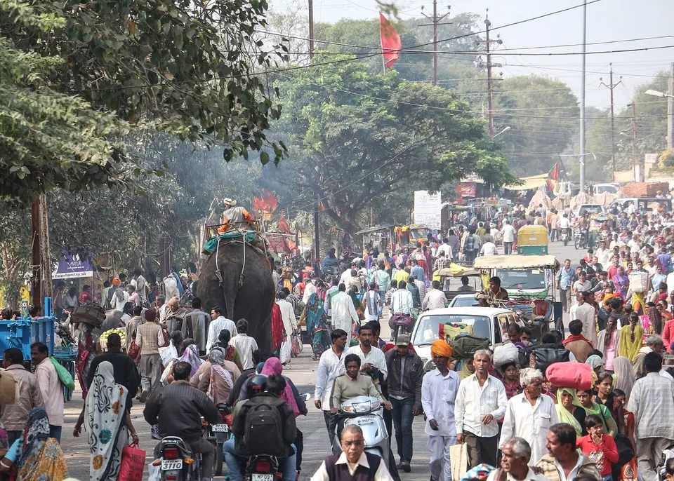 Busy Harsiddhi Marg near Mahakaleshwar Temple, Ujjain, crowded with pilgrims, autos and an elephant