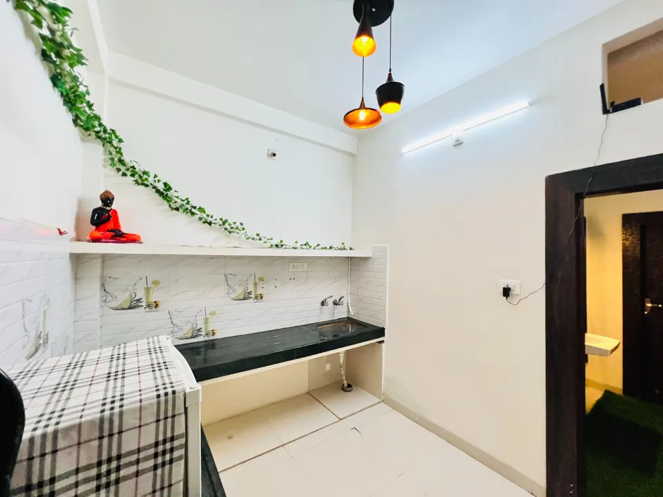Kitchenette counter with wall decor at AP Suite, AP Villas Ujjain