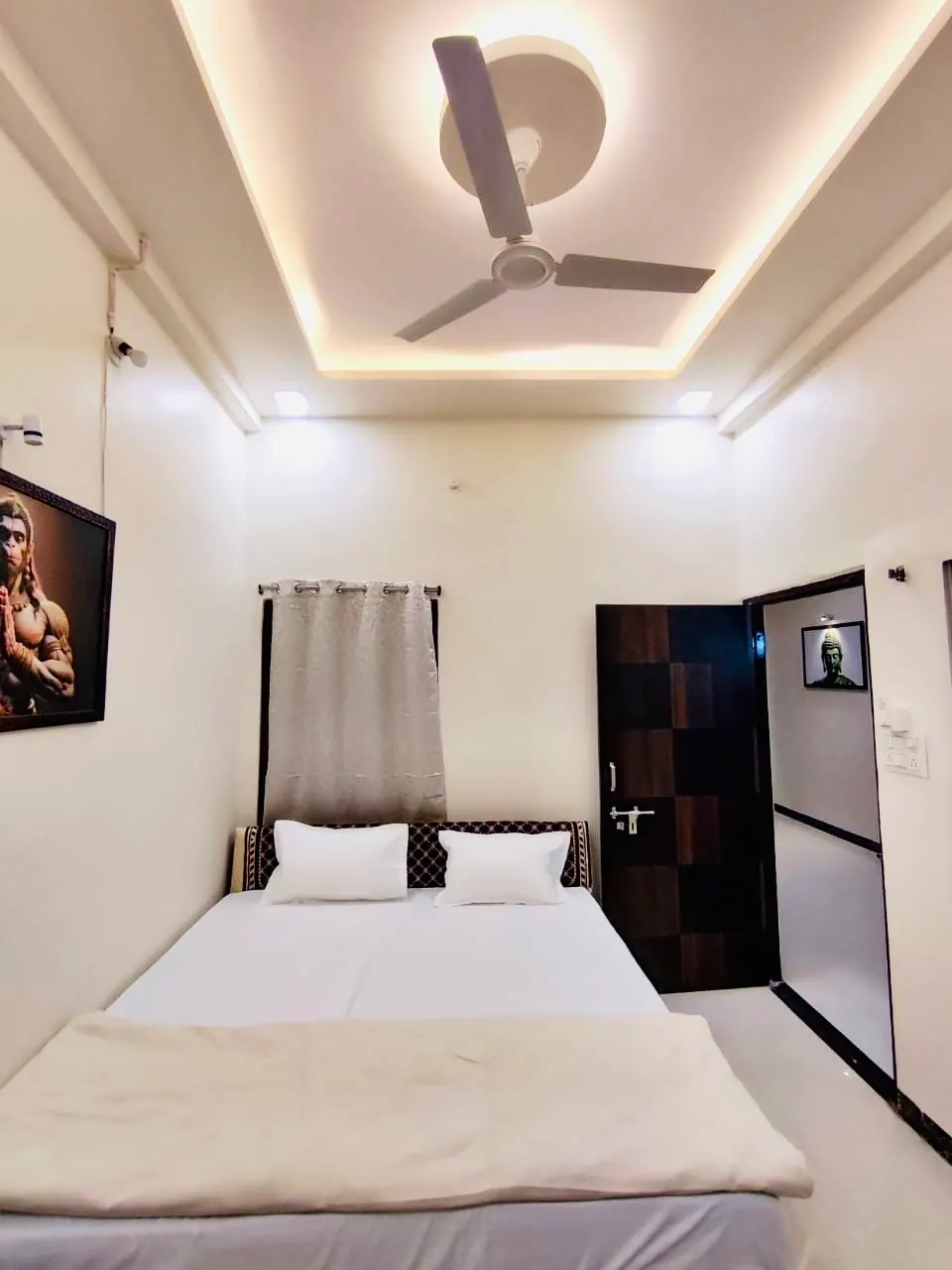 Bedroom with double bed at Divinestay, AP Villas Ujjain