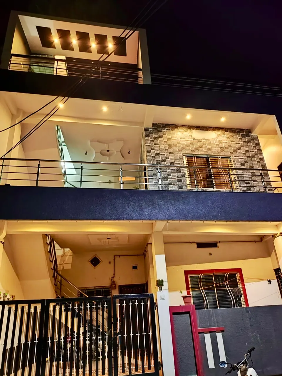 Villa balcony and facade lit at night at Divinestay, AP Villas Ujjain