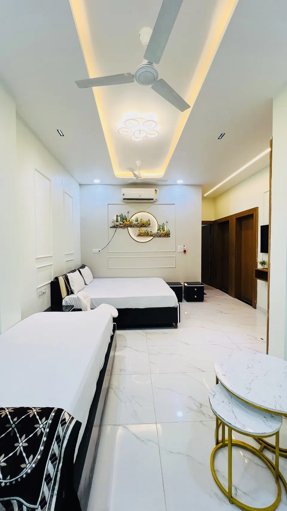 Bedroom with two beds at Rudrangan Suites, AP Villas Ujjain