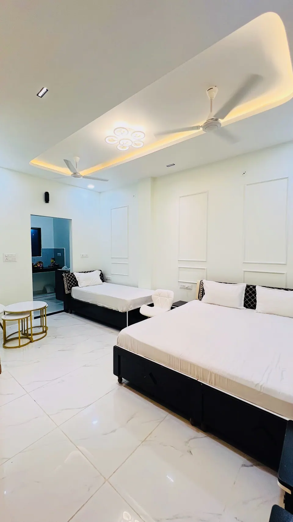 Bedroom with two beds at Rudrangan Suites, AP Villas Ujjain