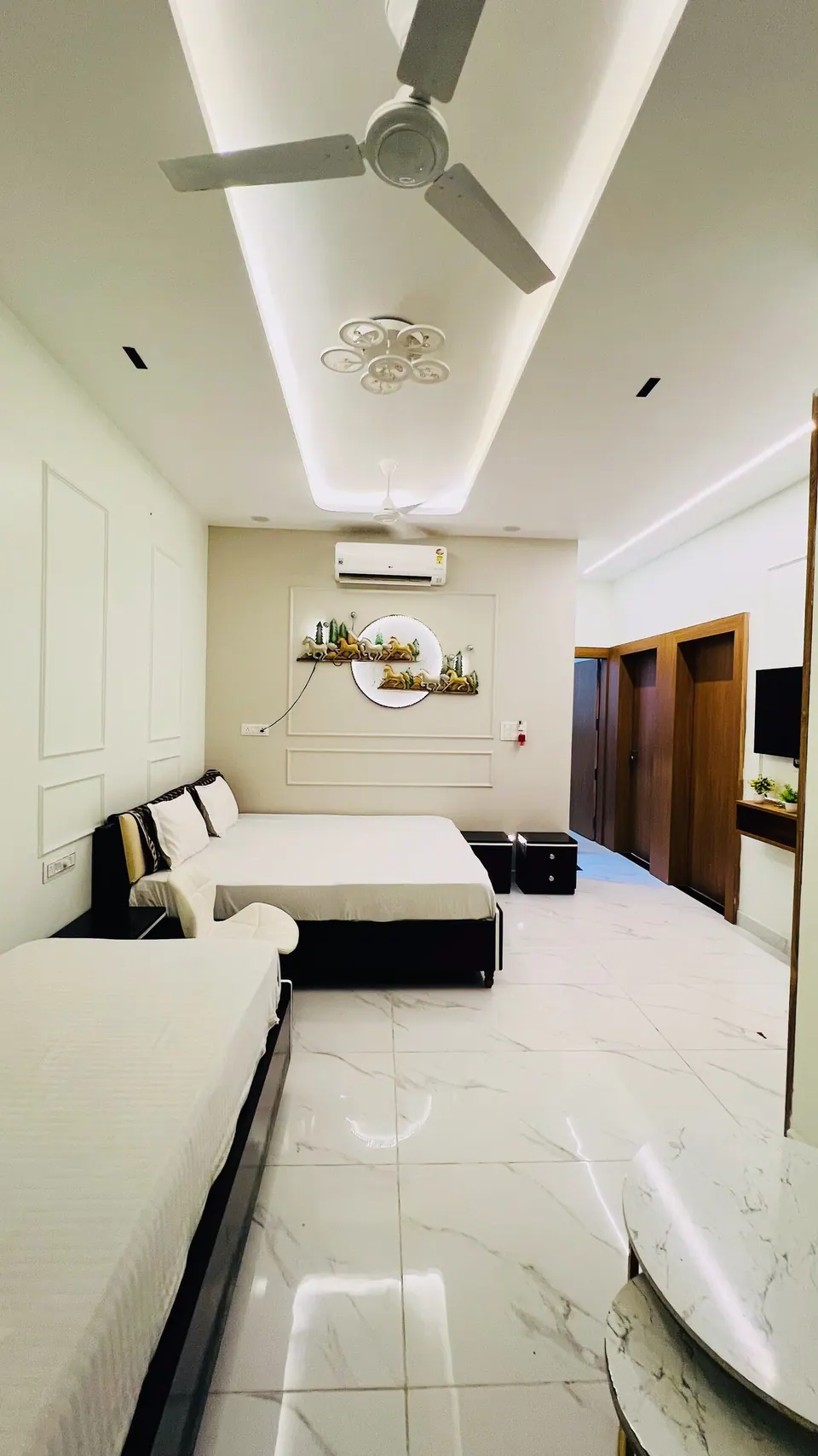 Bedroom with sofa and bed at Rudrangan Suites, AP Villas Ujjain