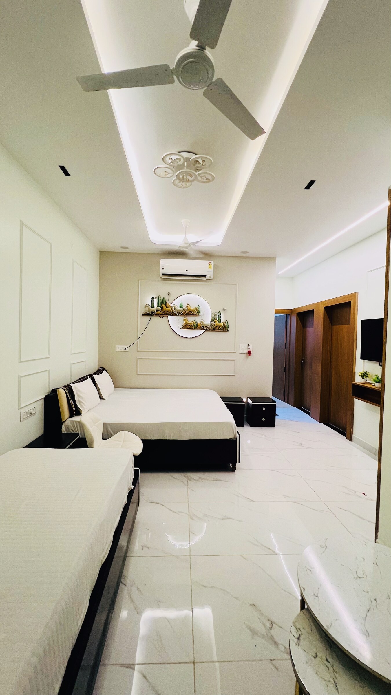 Bedroom with sofa and bed at Rudrangan Suites, AP Villas Ujjain