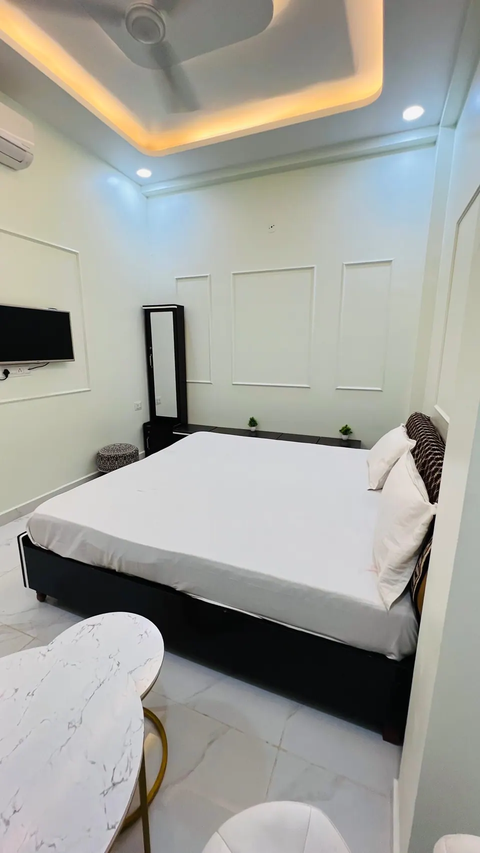 Bedroom with double bed at Rudrangan Suites, AP Villas Ujjain