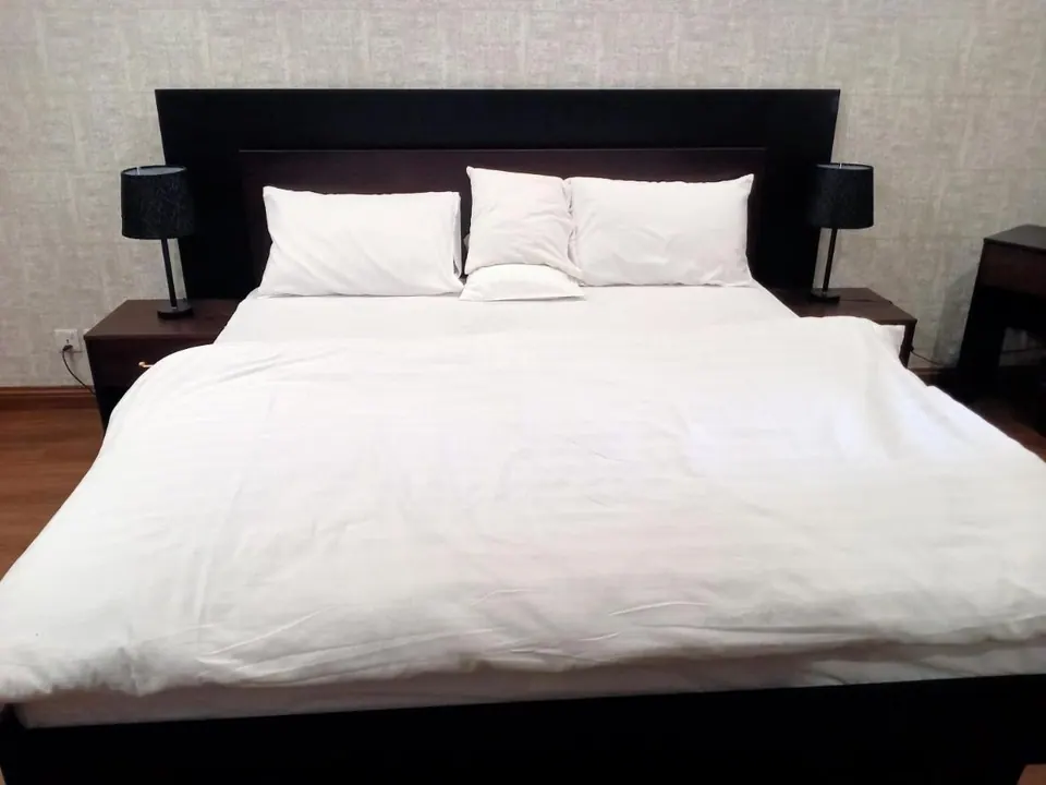 Bedroom with white linens at Villa Aranya, AP Villas Ujjain